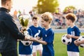 Happy Smiling Young Boys Celebrating Sports Soccer Football Championship Royalty Free Stock Photo