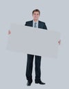 Happy smiling young business man showing blank signboard. Royalty Free Stock Photo