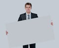 Happy smiling young business man showing blank signboard. Royalty Free Stock Photo