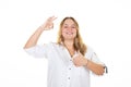 Happy smiling young business woman with fingers okay gesture showing thumb up palm sign on white background Royalty Free Stock Photo