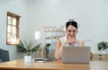 Happy smiling young Business woman with headphone in video call on laptop busy talking, concept of online chat, distance Royalty Free Stock Photo