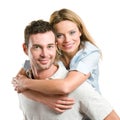 Happy smiling young couple piggyback Royalty Free Stock Photo