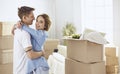 Happy smiling young couple showing a pair of keys of their new house Royalty Free Stock Photo