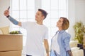 Happy smiling young couple showing a pair of keys of their new house Royalty Free Stock Photo