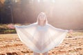 Happy smiling young girl with outstretched arms enjoying freedom. Royalty Free Stock Photo