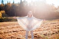 Happy smiling young girl with outstretched arms enjoying freedom. Royalty Free Stock Photo