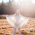 Happy smiling young girl with outstretched arms enjoying freedom. Royalty Free Stock Photo