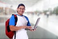 Happy Smiling Young Male Asian Student With Laptop Royalty Free Stock Photo