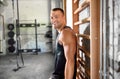 Happy smiling young man in gym Royalty Free Stock Photo