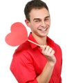 Happy smiling young man with red love hear holiday valentine sym