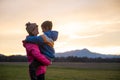 Happy smiling young mother holding his son in her arms looking at him lovingly Royalty Free Stock Photo