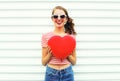 Happy smiling young woman with air balloons heart shape having fun over white Royalty Free Stock Photo