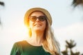 Happy smiling young woman with blonde hair wearing sunglasses enjoying sunny summer day, vacation, travel concept Royalty Free Stock Photo