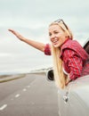 Happy smiling young woman in car window Royalty Free Stock Photo