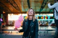 Young pretty woman blogger with cotton candy