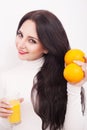 Happy smiling young woman drinking orange juice Royalty Free Stock Photo