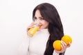 Happy smiling young woman drinking orange juice Royalty Free Stock Photo