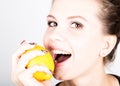 Happy smiling young woman holding fresh juicy lemons. Healthy eating, fruits and vegetables. Royalty Free Stock Photo