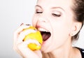 Happy smiling young woman holding fresh juicy lemons. Healthy eating, fruits and vegetables. Royalty Free Stock Photo