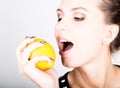 Happy smiling young woman holding fresh juicy lemons. Healthy eating, fruits and vegetables. Royalty Free Stock Photo