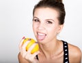 Happy smiling young woman holding fresh juicy lemons. Healthy eating, fruits and vegetables. Royalty Free Stock Photo