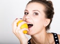 Happy smiling young woman holding fresh juicy lemons. Healthy eating, fruits and vegetables. Royalty Free Stock Photo