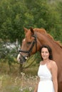 Happy smiling young woman and horse Royalty Free Stock Photo