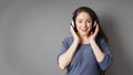 Happy smiling young woman listening to music with headphones Royalty Free Stock Photo