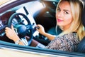 Happy young woman in the modern luxury car Royalty Free Stock Photo