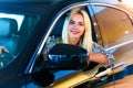 Happy young woman in the modern luxury car Royalty Free Stock Photo