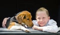 Happy smilling little girl and beagle puppy Royalty Free Stock Photo