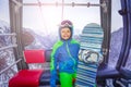 Happy snowboarding boy with snowboard in ski cabin Royalty Free Stock Photo