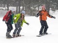 Happy snowboarding teens team Royalty Free Stock Photo