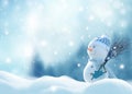 Happy snowman with a broom in hand, standing in Christmas landscape. Snow background. Winter fairytale Royalty Free Stock Photo