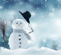 Happy snowman standing in winter Christmas landscape.