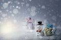 Happy snowman with xmas presents on sunny winter day. Royalty Free Stock Photo