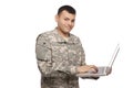 Soldier typing lon laptop Royalty Free Stock Photo