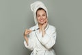 Happy spa woman with cute smile, white teeth, toothbrush and toothpaste on white Royalty Free Stock Photo