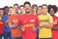 Happy spanish football fan with group of other european supporters Royalty Free Stock Photo