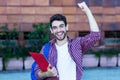 Happy spanish male student cheering about graduation Royalty Free Stock Photo