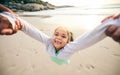 Happy, spin and portrait of child at the beach for travel, support and fun. Swinging, smile and summer with girl and