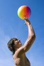 Happy sport build teenager boy with ball in beach Royalty Free Stock Photo
