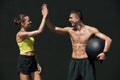 Happy sport couple after fitness workout giving high five