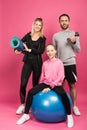 happy sportive family with fit ball, fitness mat and dumbbell isolated