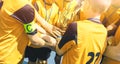 Happy Sports Team. Kids In Elementary School Sports Team Raising Golden Trophy