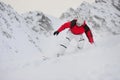 Happy sportsman with snowboard in motion