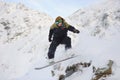 Happy sportsman with snowboard in motion