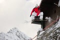 Happy sportsman with snowboard in motion