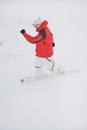 Happy sportsman with snowboard in motion