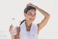 Happy sporty woman holding a bottle of mineral water for refresh Royalty Free Stock Photo